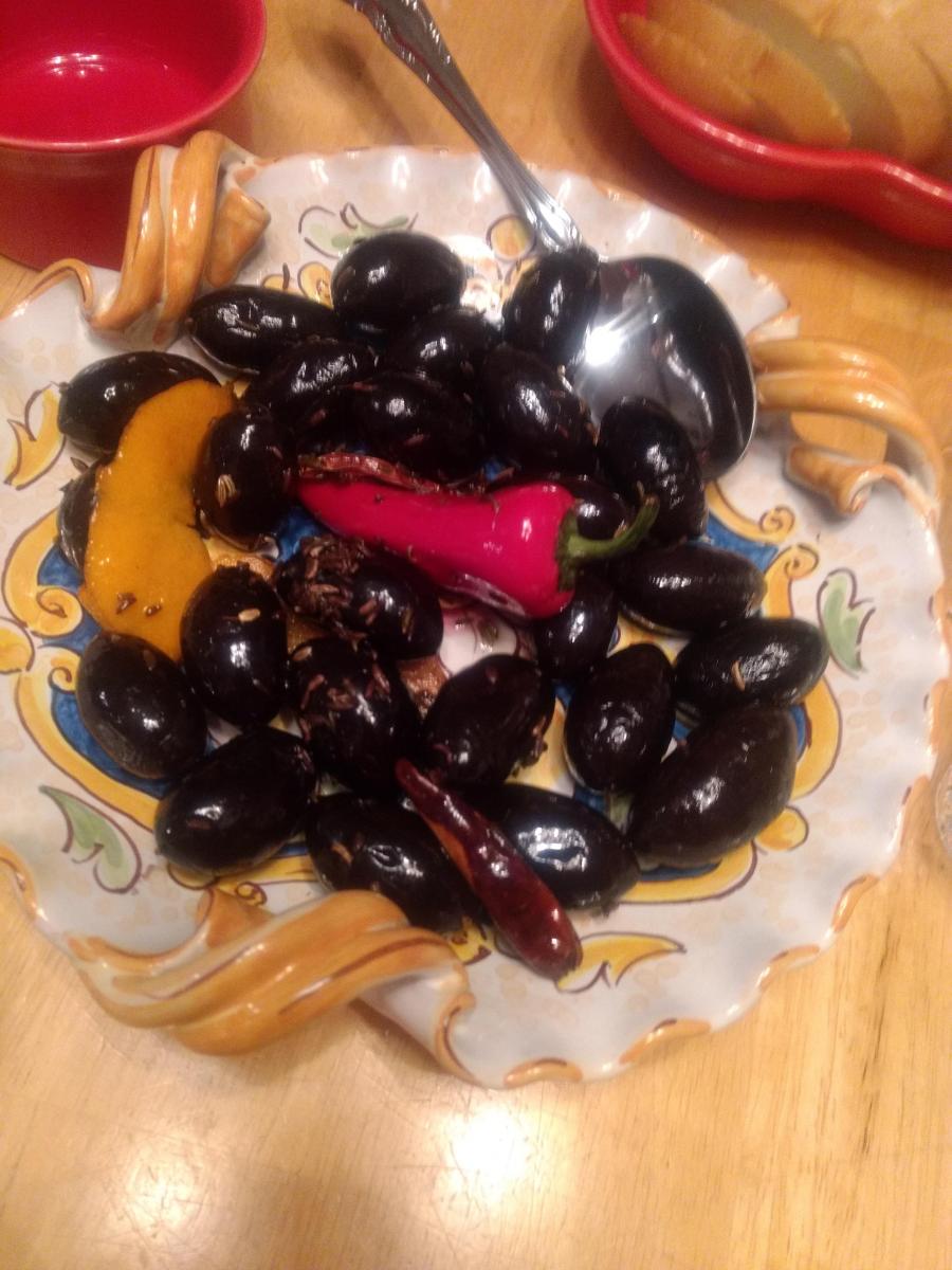 Warm black olives appetizer