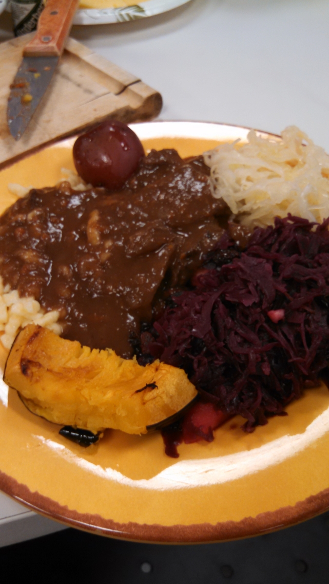 Sauerbraten with red cabbage, acorn squash, spaetzl, and a potato