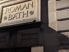 "Roman Bath sign in stone"